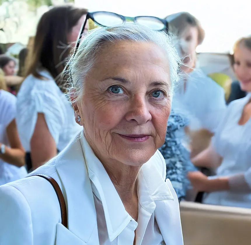 Portrait of Mark, elderly woman smiling during seminar or group session